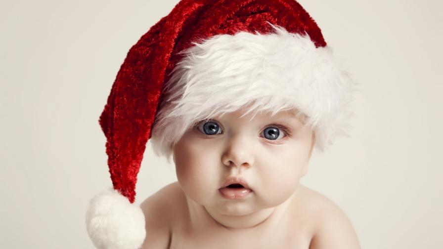 Милый ребенок в шляпе Санта HD